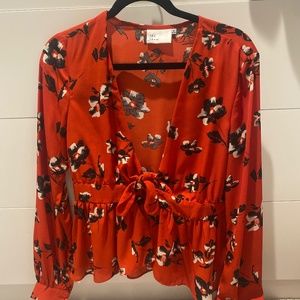 Red floral blouse